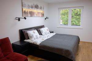 Un pat sau paturi într-o cameră la Apartma La Casa