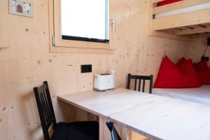 Ένα ή περισσότερα κρεβάτια σε δωμάτιο στο Camping Muglin