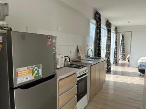 Köök või kööginurk majutusasutuses ACÉRCATE Aparts & Parking - BREÑA
