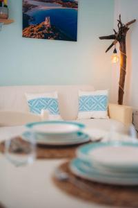 A seating area at Dimora Pintau in residence con piscina privata