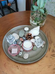 a plate with rocks and seashells on a table at HAMBOULA in Polis Chrysochous