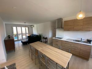 a kitchen and living room with a table and chairs at Appartement T3 à la Seyne sur mer in La Seyne-sur-Mer