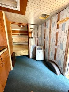 a small room with a bed and a washer at Караваната На Морето in Sozopol