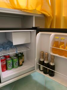 an open refrigerator filled with lots of drinks at B&B Don Luì in Forio d'Ischia