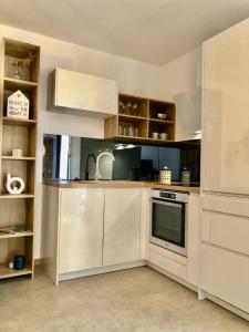 Kuchyň nebo kuchyňský kout v ubytování Apartmani CUBE L