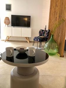 TV a/nebo společenská místnost v ubytování Apartmani CUBE L