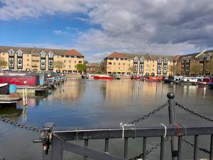 a view of a river with buildings and boats at Gracenote Properties Hemel Hempstead - serviced apartment with FREE parking in Hemel Hempstead