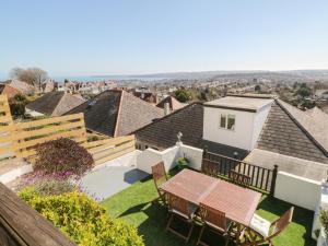 an aerial view of a backyard with a table and chairs at Pebble Lodge in Paignton