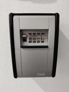 a soap dispenser attached to a wall at Eva Beach Studio in Néa Péramos +33 photos