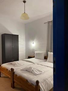 Postel nebo postele na pokoji v ubytování LUNAR MELODY