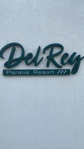 a sign for a real rexarma restaurant on a wall at DEL REY in Paralia Katerinis