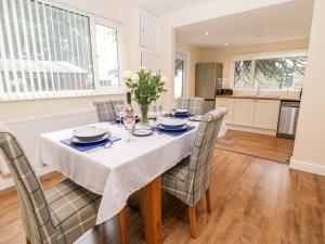 a kitchen and dining room with a table and chairs at Cedar Holme in Chesterfield