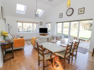 a living room with a table and chairs at Stubb Oak in Malvern Wells
