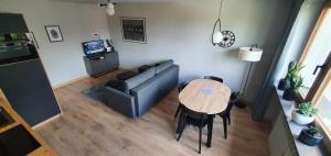 a living room with a couch and a table at Apartament 710 in Katowice