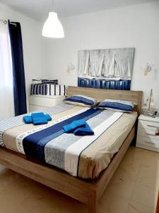 מיטה או מיטות בחדר ב-Bella Vita