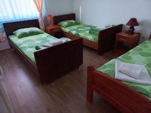 Letto o letti in una camera di Apartmani Sobe Sljivancanin
