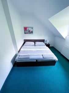 מיטה או מיטות בחדר ב-Minihotel Vitex