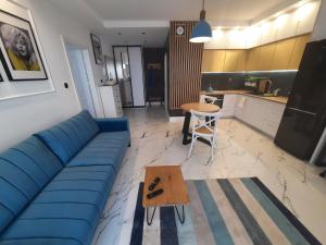 Kuchyňa alebo kuchynka v ubytovaní Super Centrum Szymborskiej 2 z parkingiem podziemnym Apartamenty LUNA Bialystok