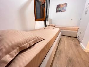 Postel nebo postele na pokoji v ubytování Arteg Apartments - Superior