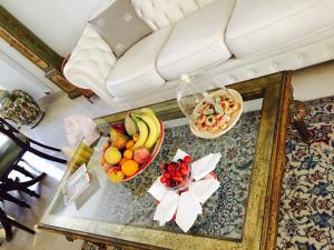 a table with a bowl of fruit and a bowl of nuts at Esclusiva Luxury Villa con giardino in Ischia +21 photos