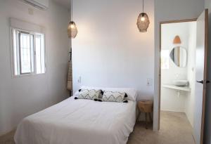 A bed or beds in a room at Exclusivo cortijo con piscina privada