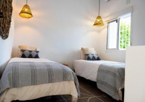 A bed or beds in a room at Exclusivo cortijo con piscina privada