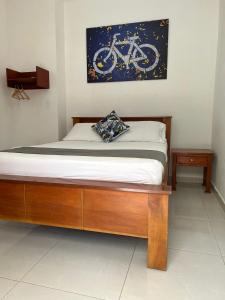 En eller flere senge i et værelse på El Hotel de los Ciclistas