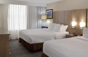 A bed or beds in a room at Crowne Plaza Cleveland Airport, an IHG Hotel