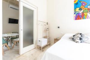 Łóżko lub łóżka w pokoju w obiekcie LE CASE DEL FICO D'INDIA FAVIGNANA