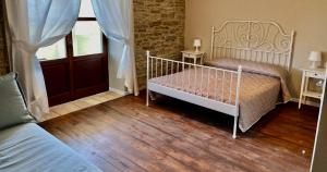 A bed or beds in a room at Agriturismo Il Noce d'Oro