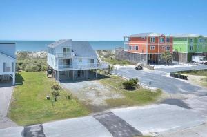 an aerial view of a house on the beach at 1 More Day in Oak Island
