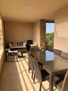 Posedenie v ubytovaní Résidence Luxe à Porto Vecchio