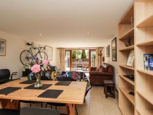 a living room with a table and a couch at Loose Farm Lodge in Battle