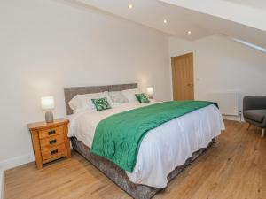 Llit o llits en una habitació de Bramblewood Cottage