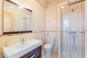 a bathroom with a sink and a toilet and a shower at Historic Center 1 in Coimbra