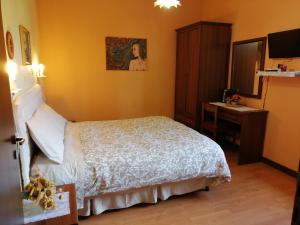 Postel nebo postele na pokoji v ubytování B&B Il Ghiro-Country House