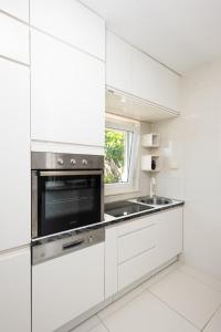 Kuchyň nebo kuchyňský kout v ubytování Apartments Viky