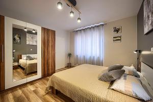 Postel nebo postele na pokoji v ubytování Apartment Korado