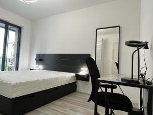 Postel nebo postele na pokoji v ubytování Kibilù - Cascina Merlata Rho Fiera Ospedale Galeazzi