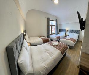 Postel nebo postele na pokoji v ubytování Casona Plaza Hotel Cusco