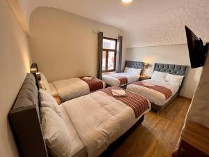 Postel nebo postele na pokoji v ubytování Casona Plaza Hotel Cusco