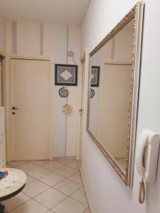 a bathroom with a mirror and a toilet at Apartment Green Note in Split
