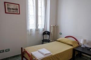 Posteľ alebo postele v izbe v ubytovaní Foresteria Roma Esercito della Salvezza
