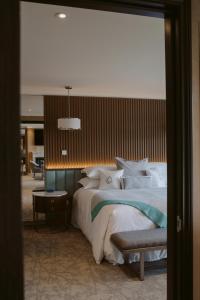Voodi või voodid majutusasutuse The Carlin Boutique Hotel toas