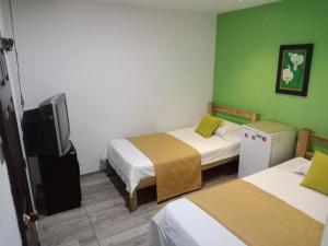 Lova arba lovos apgyvendinimo įstaigoje Hotel Cañaveral Plaza