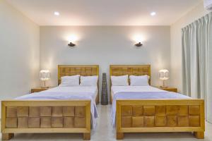 Postel nebo postele na pokoji v ubytování Villa Tropical Piscina Vista a Campo de Golf Juan Dolio - 11 Pax
