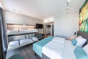 a hotel room with a bed and a desk at Best Western Plus Hotel Ilulissat in Ilulissat