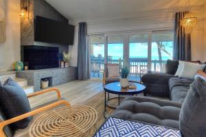a living room with a couch and a fireplace at Pipers Run 7 in Clearwater Beach