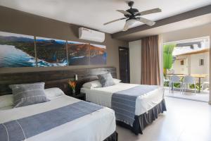 Tempat tidur dalam kamar di Palo Verde Sustainable Hotel