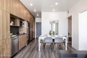 a kitchen and dining room with a white table and chairs at Park City Slope Side - Canyons in Park City